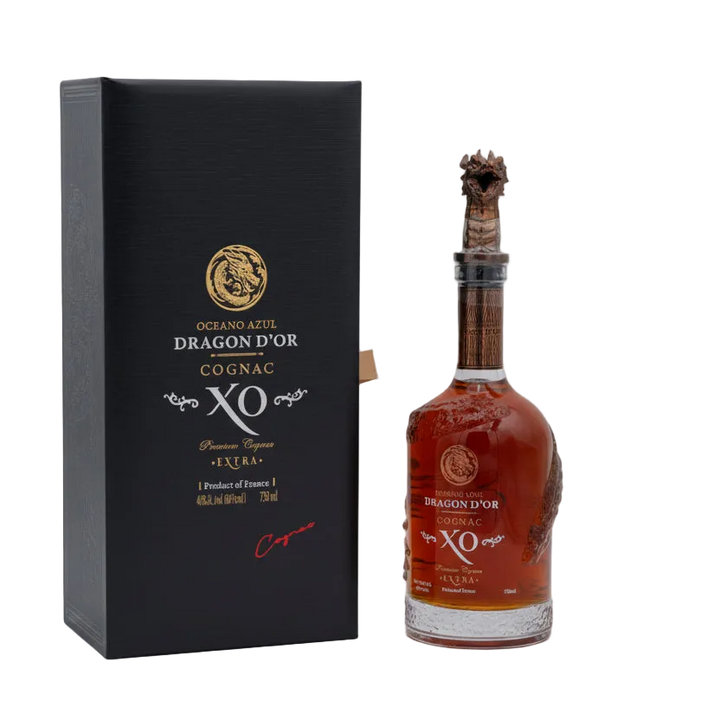Oceano Azul Dragon D'Or Cognac XO bottle with sculpted dragon stopper beside its black presentation box.