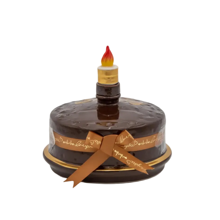 Oceano Azul Round Chocolate La Cake vodka in a round chocolate-colored cake bottle with ribbon and candle stopper.