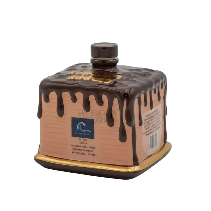 Oceano Azul square chocolate-colored La Cake bottle with gold trim and chocolate-drip design.