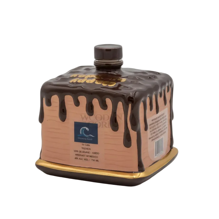 Oceano Azul square chocolate-colored La Cake bottle with gold trim and chocolate-drip design.