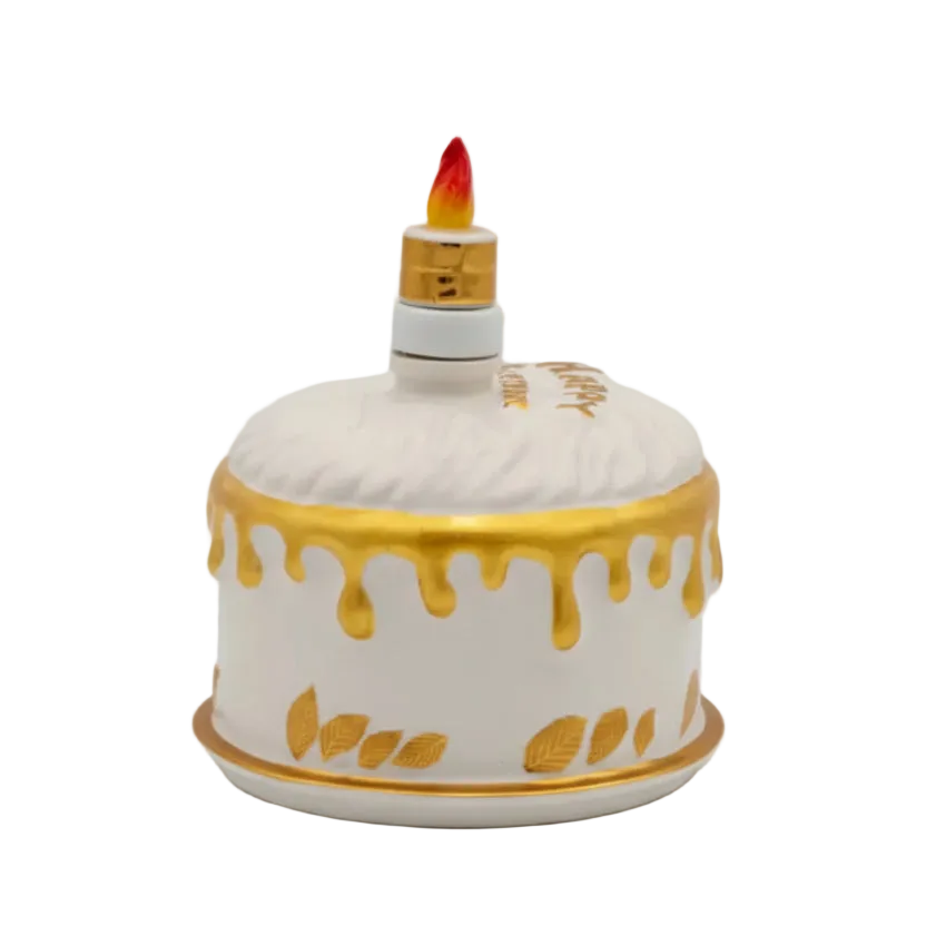 Oceano Azul Round White La Cake vodka in a white-and-gold cake-shaped bottle with candle stopper.