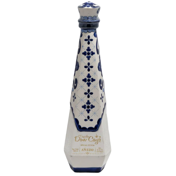 Don Cayo Añejo ceramic tequila bottle with blue floral decoration on white.
