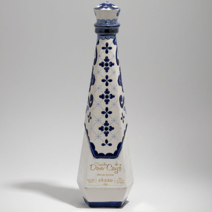Decorative bottle with blue floral patterns on a white background