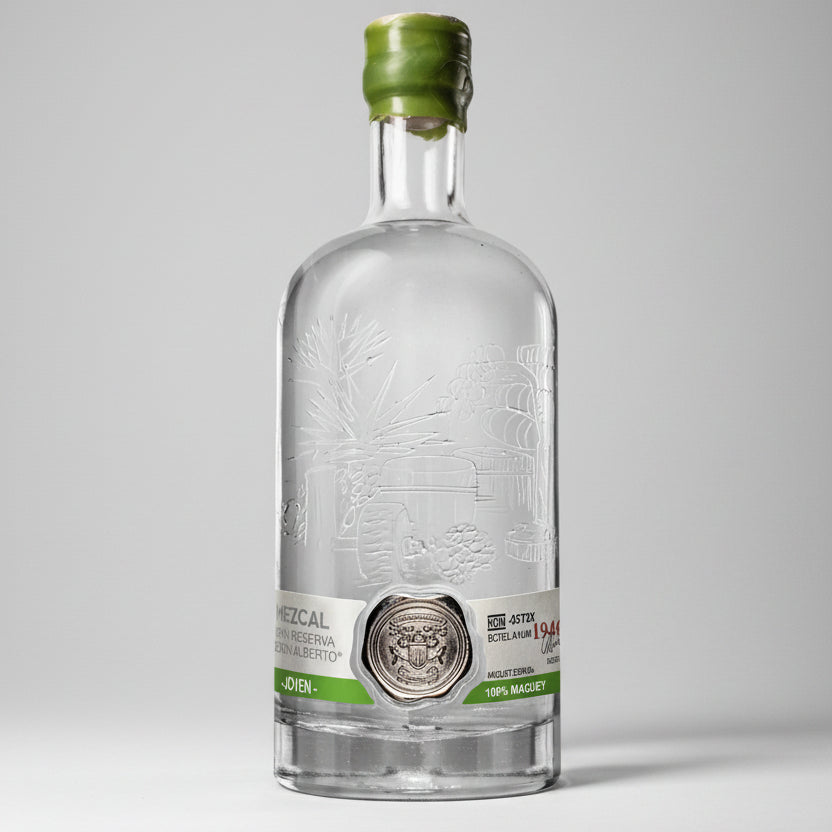 Clear bottle with green cap on a white background