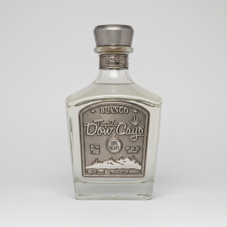 Tequila bottle with silver cap and label on a white background