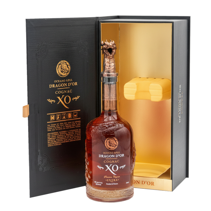 Oceano Azul Dragon D'Or Cognac XO bottle in front of its open black presentation box with gold lining.