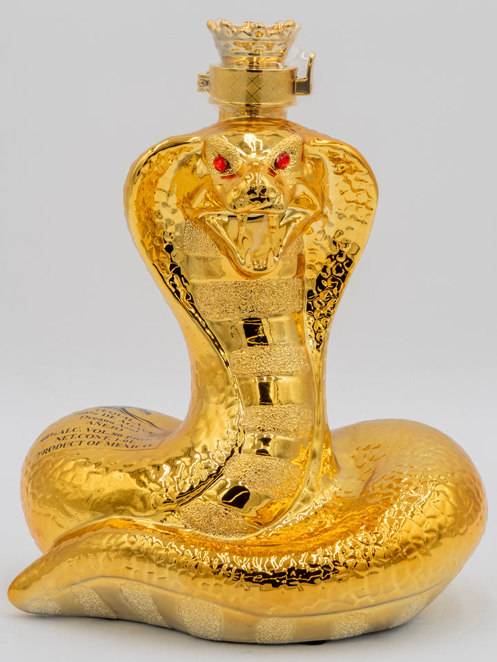 Gold snake-shaped bottle with a detailed design on a gray background