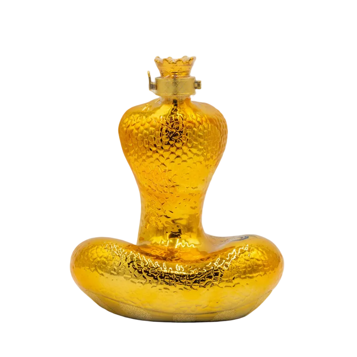 Gold-colored bottle with a textured surface on a white background.