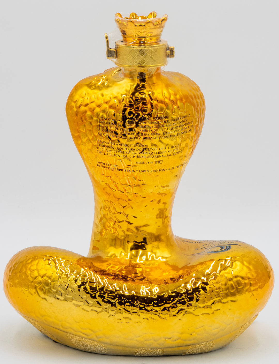 Gold-colored bottle with a textured surface on a white background