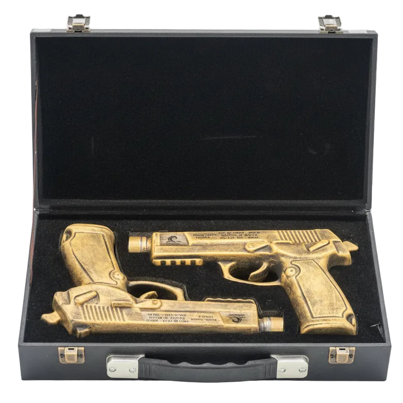 Bronze gun-shaped objects in a black case on a white background.