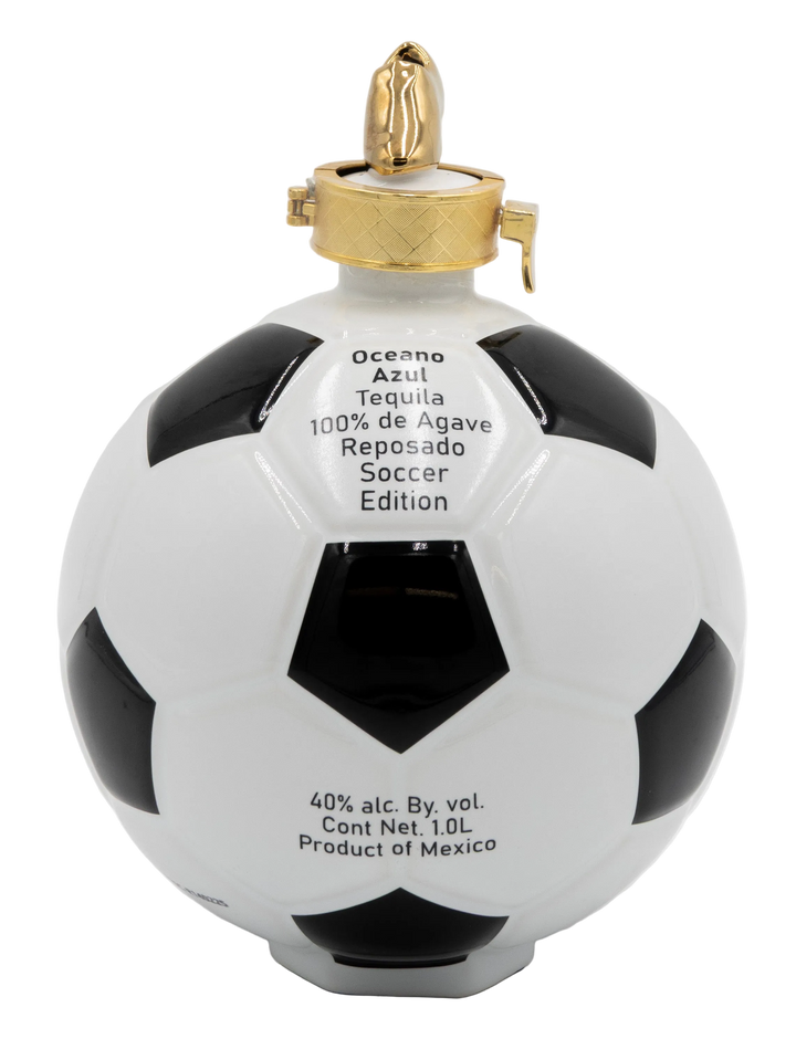 Oceano Azul Soccer Ball Reposado Tequila bottle with gold cap, black-and-white panels, and front product label.