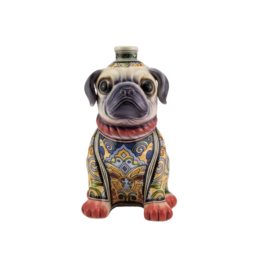 A sculptural bottle of Oceano Azul Pug Añejo Tequila, designed like a sitting dog.