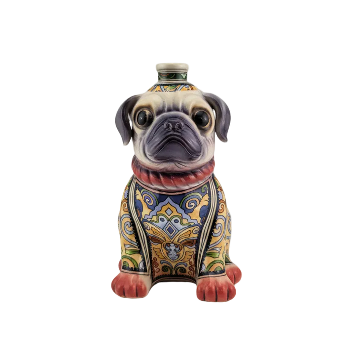 A sculptural bottle of Oceano Azul Pug Añejo Tequila, designed like a sitting dog.