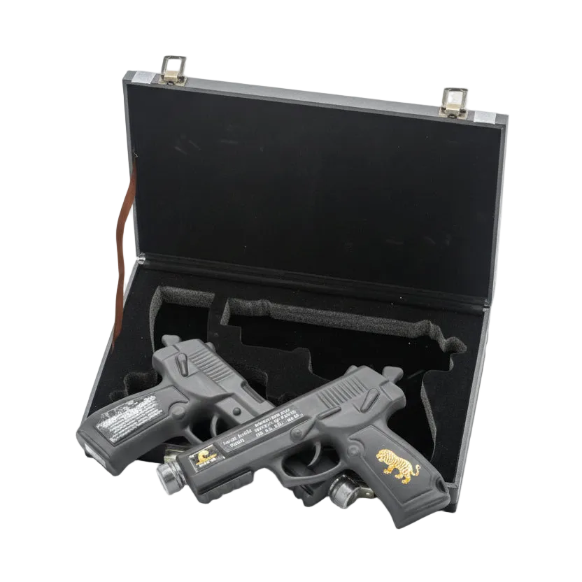 Oceano Azul Double Trouble Vodka in two pistol-shaped bottles with an open black presentation case.