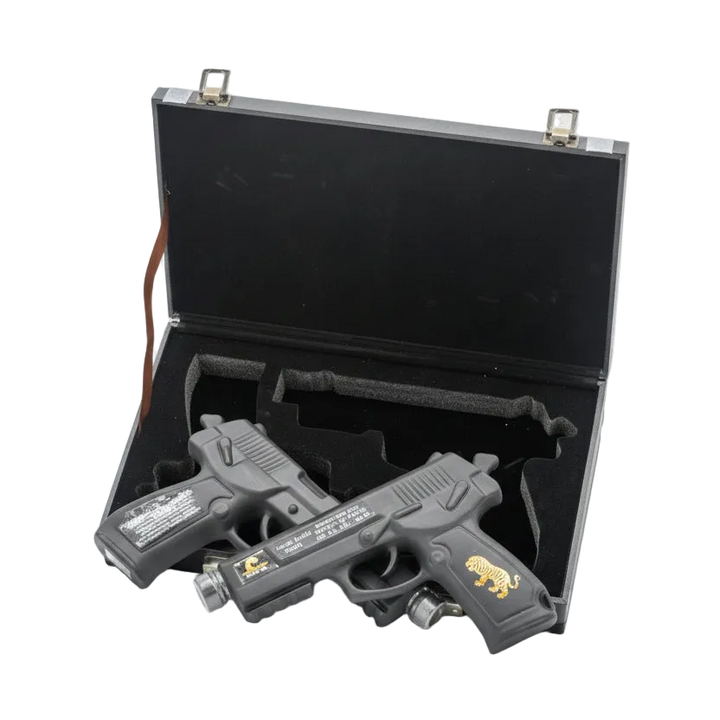 Oceano Azul Double Trouble Vodka in two pistol-shaped bottles with an open black presentation case.