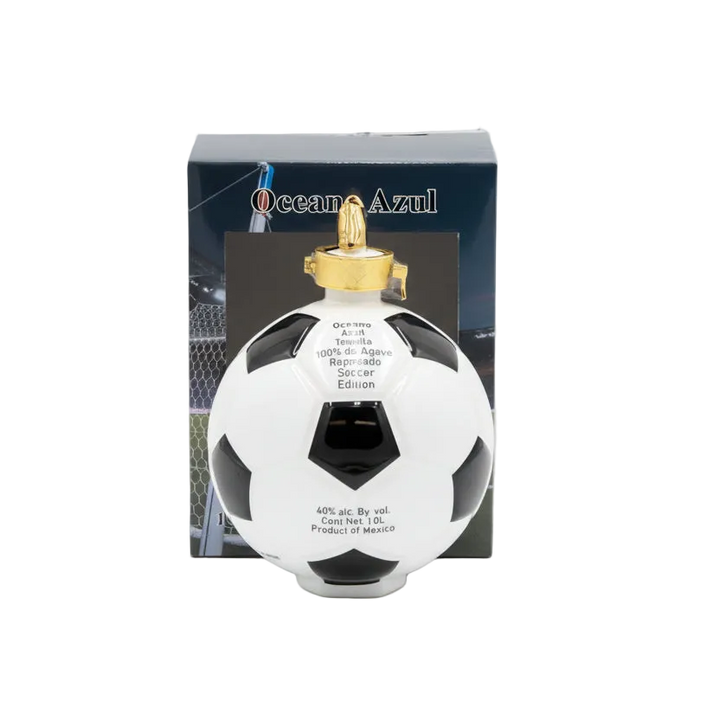 Oceano Azul Soccer Ball Reposado Tequila bottle with gold cap in front of its branded box.