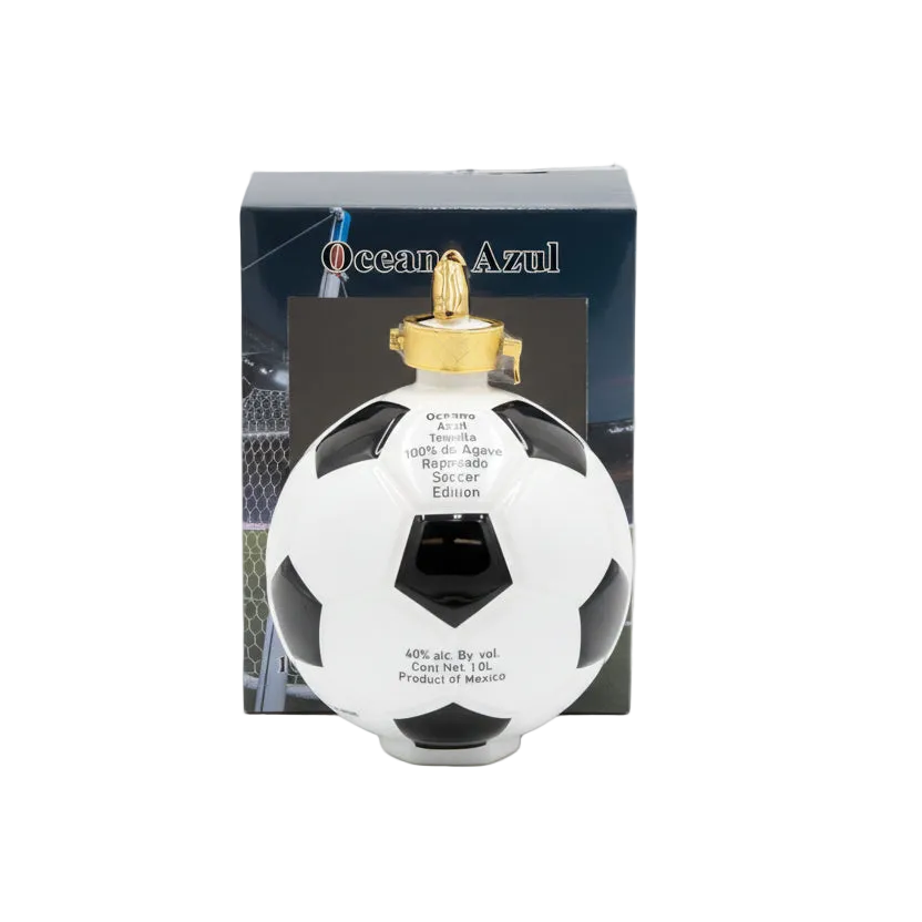 Oceano Azul Soccer Ball Reposado Tequila bottle with gold cap in front of its branded box.