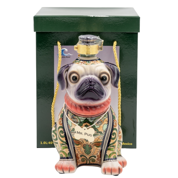 Decorative bottle shaped like a pug with a green box in the background