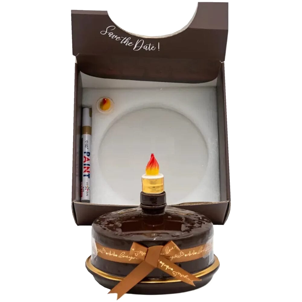 Oceano Azul Round Chocolate La Cake bottle in front of its open presentation box with included accessories.
