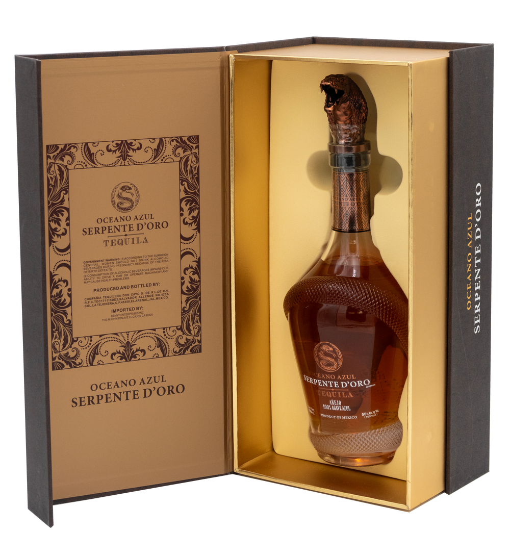 Oceano Azul Serpente D'Oro tequila bottle inside its open gold-lined presentation box.