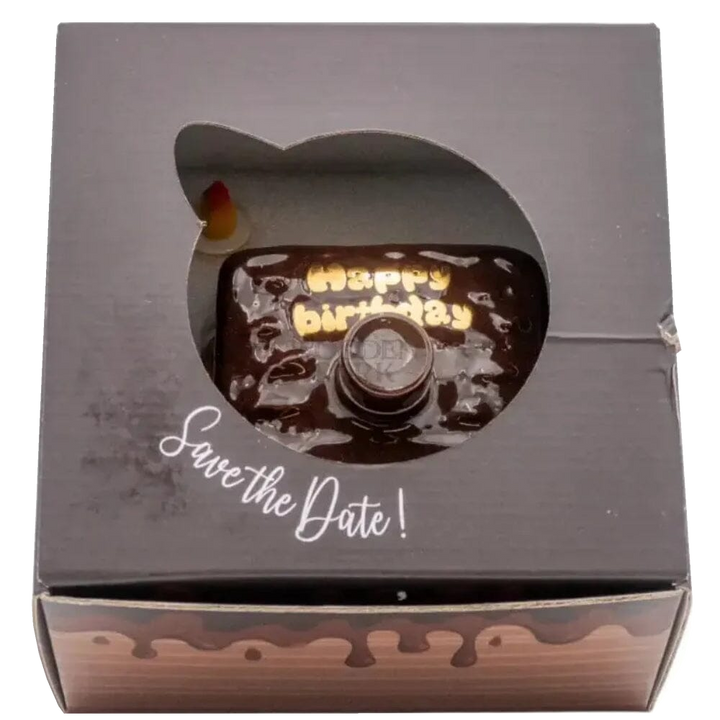 Oceano Azul square chocolate-colored La Cake bottle viewed through the window of its closed presentation box.