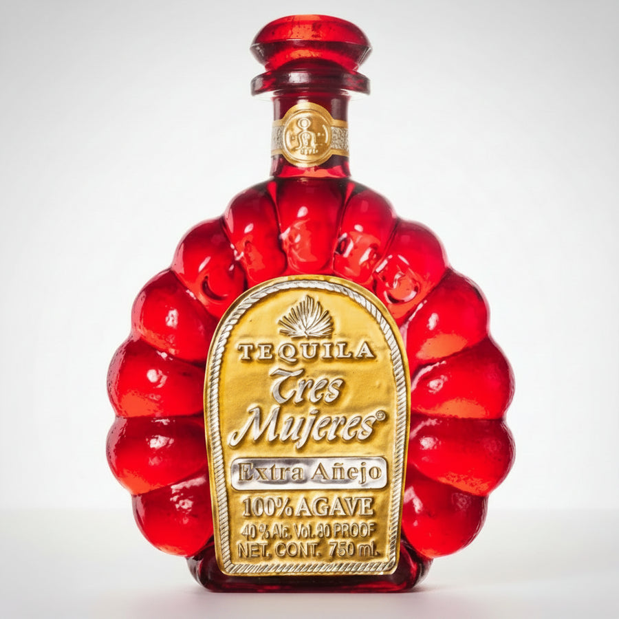 Red tequila bottle with gold label on a white background